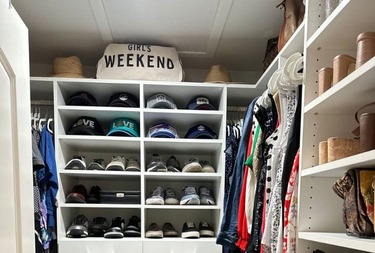 A professional organizer transformed this closet into a perfectly organized space, filled with an extensive collection of shoes and clothes.