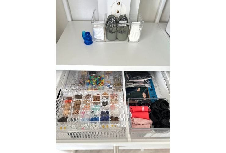A white dresser neatly organized by a professional organizer with various items, perfect for closets.